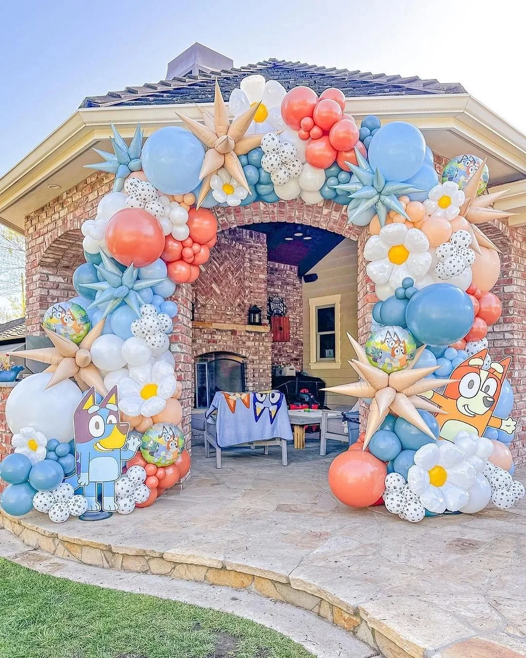 Large custom balloon installation framing an event entrance