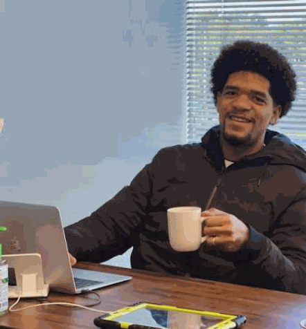 Blair Henderson working at his desk
